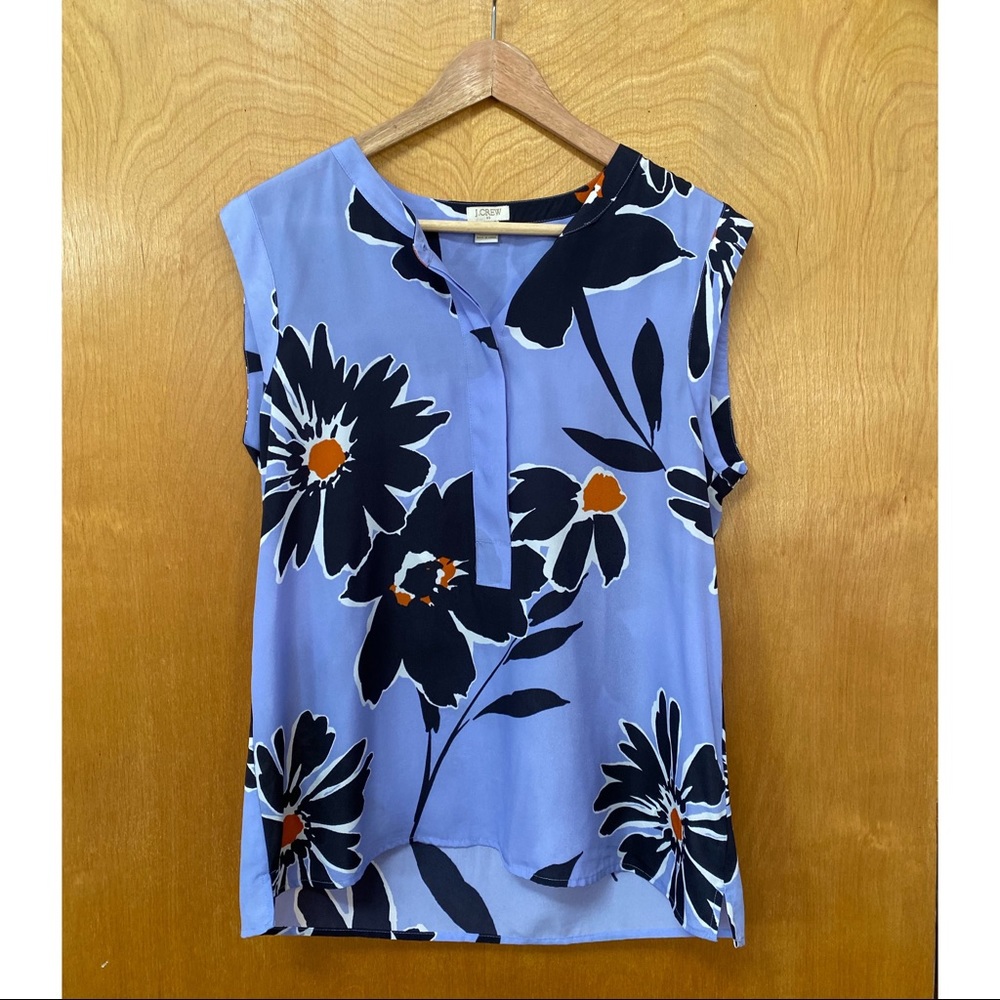 Women’s sleeveless half button floral blouse